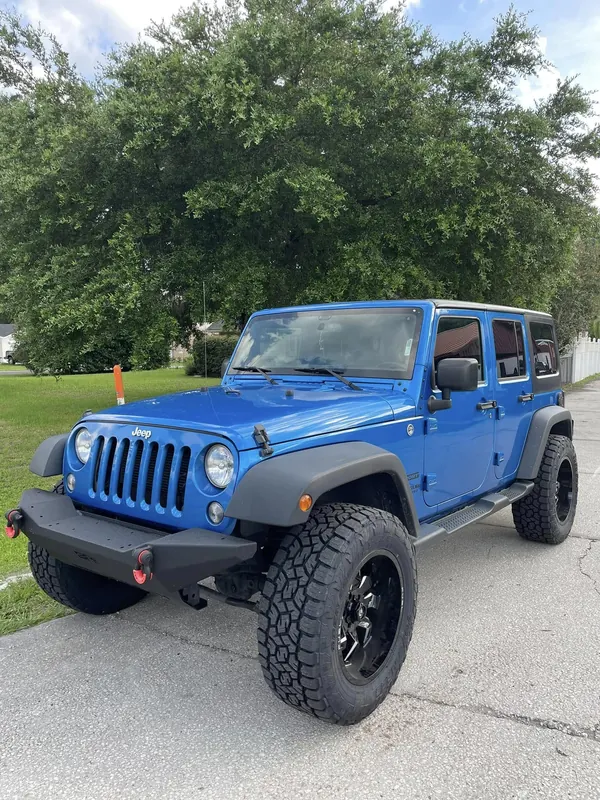 Blue Jeep Wrangler Unlimited on Fuel wheels and Toyo Open Country tires