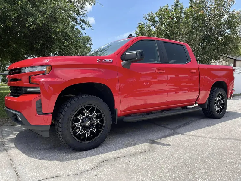 Red Chevy Silverado Z71 on black and machined wheels